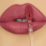 closeup of lips wearing pink liquid lipstick